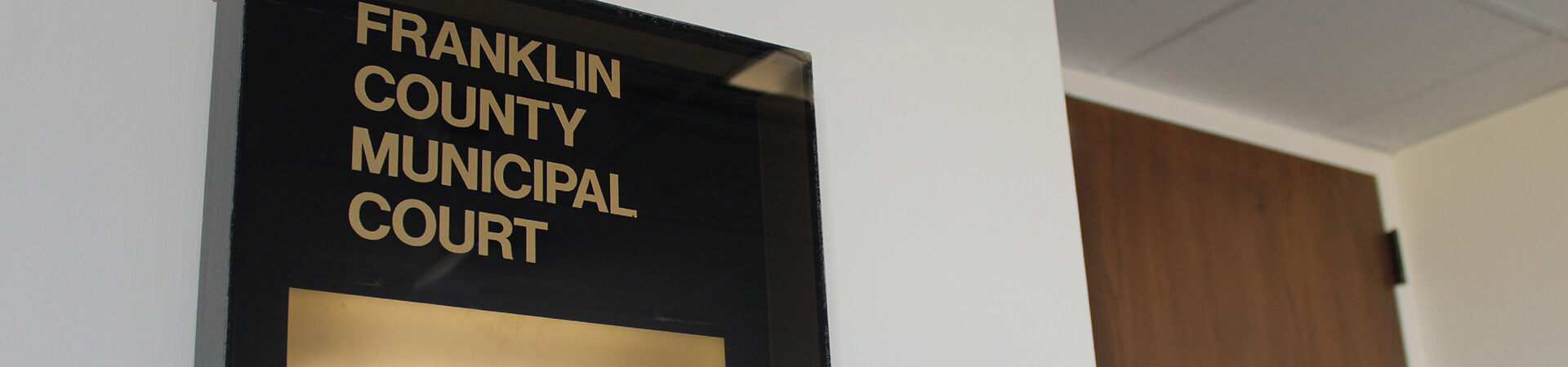 Image of a sign outside a courtroom