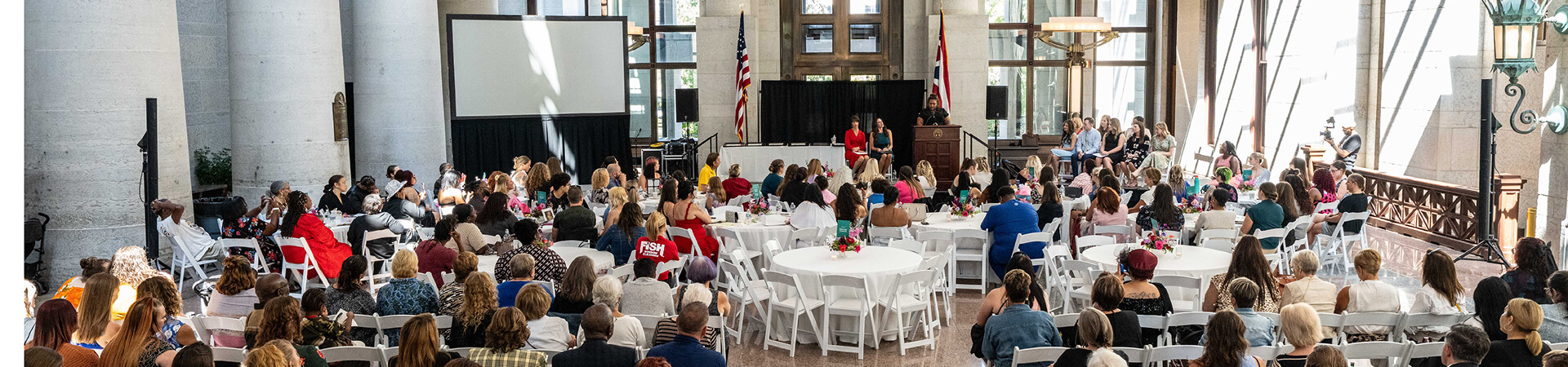 Photo of a graduation ceremony in a large assembly room