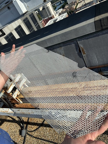 fencing-on-old-window-washers-that-has-fallen-to-the-street.jpg