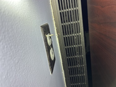 metal-sticking-out-of-one-of-the-outlets-in-room-connected-with-one-of-the-courtrooms.jpg